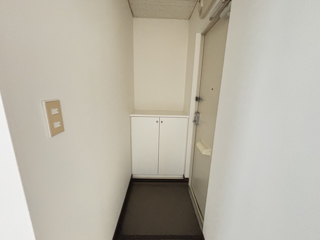 グランイルつくし野 101 玄関