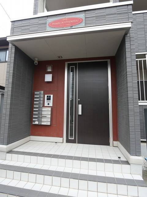 プランドール松美台 303 玄関